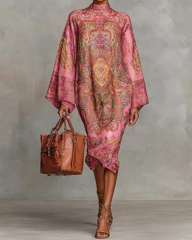 Pink midi dress with paisley pattern, featuring wide sleeves and long sleeves.