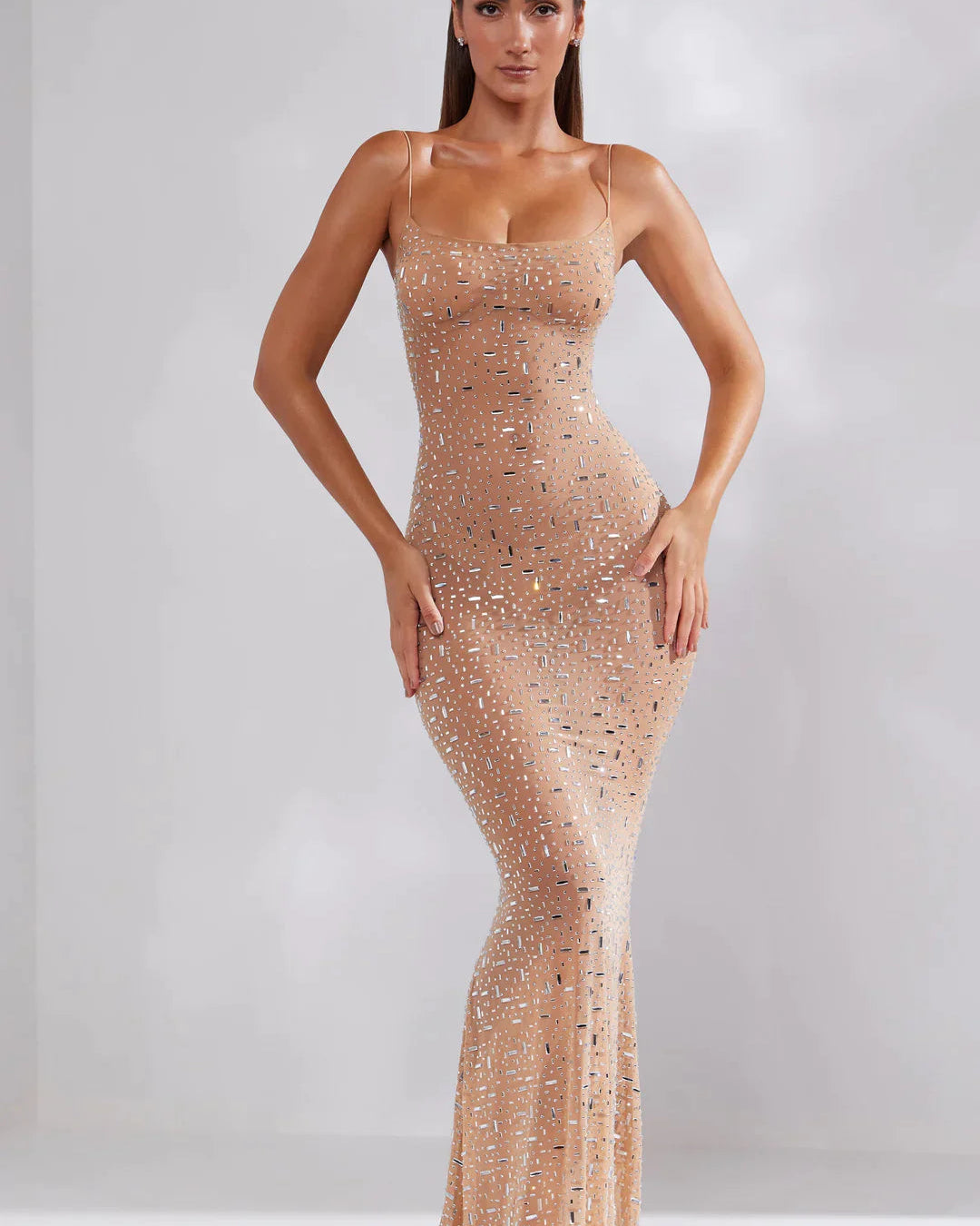 Women's fitted maxi dress with thin straps and embellishments
