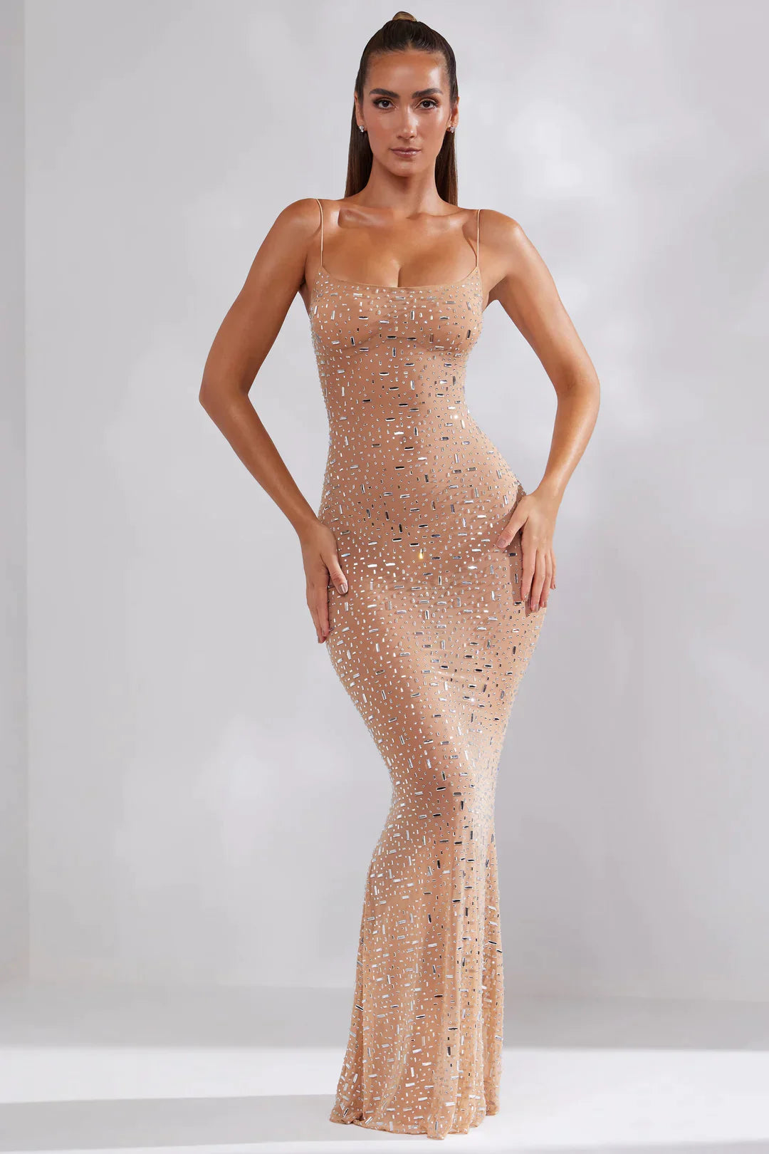 Women's fitted maxi dress with thin straps and embellishments