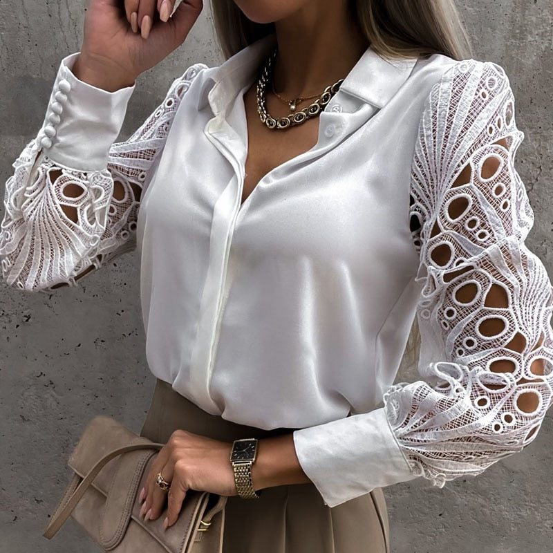 Women's blouse with a collar and lace sleeves with buttons