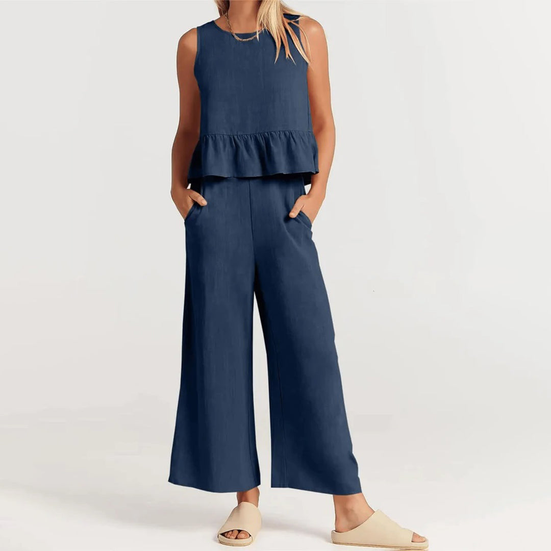 Wide women's trousers and women's blouse with ruffle