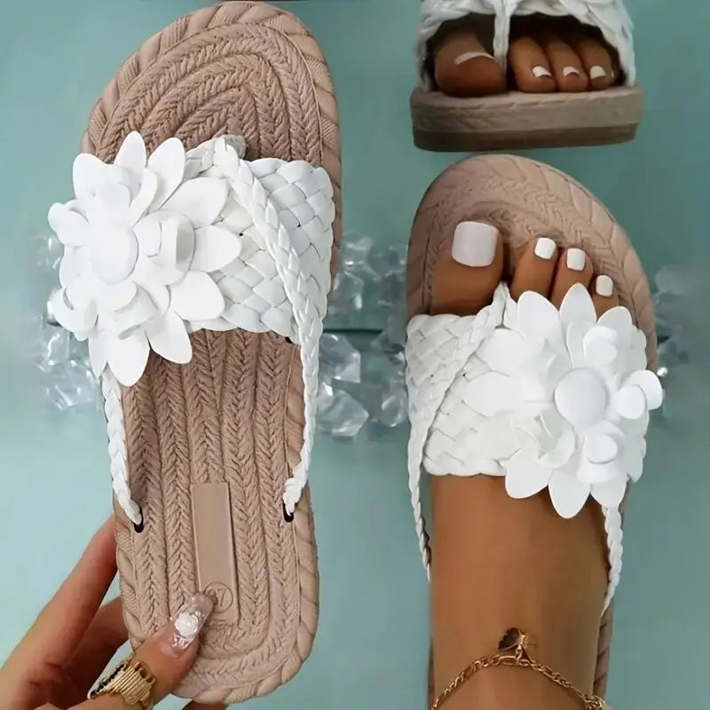 Women's sandals with woven strap and floral decoration