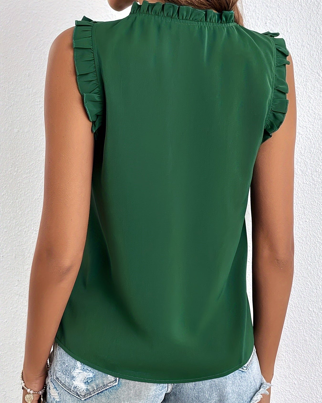 Women's sleeveless blouse with a ruffle at the neckline and tie