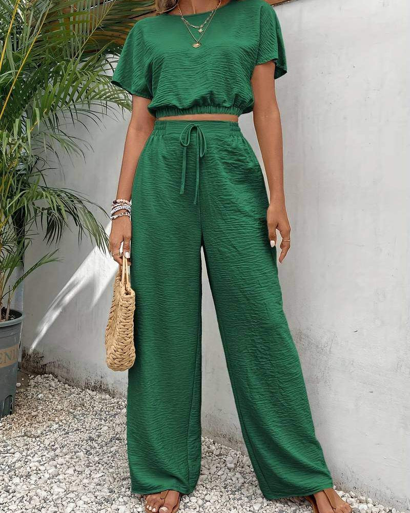 Women's complete set: blouse and pants with a waist tie